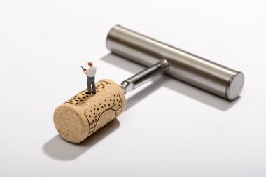 Wine bottle opener with a tiny sommelier clipart