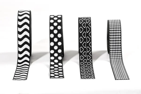 Four different black and white elastic ribbons — Stock Photo, Image