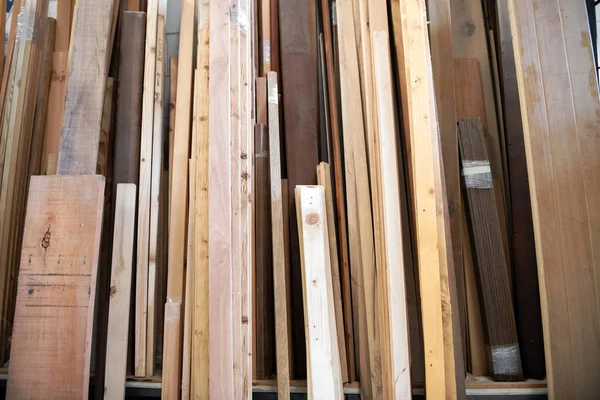 Stack of assorted wooden panels in a workshop — Stock Photo, Image