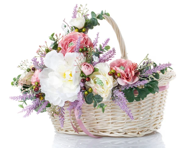 Basket with flowers to celebrate Easter on a white background — Stock Photo, Image