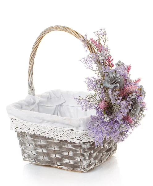 Basket with flowers to celebrate Easter on a white background — Stock Photo, Image
