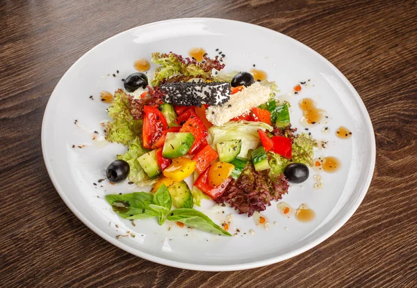 Traditional greek salad with fresh vegetables. Restaurant healthy food
