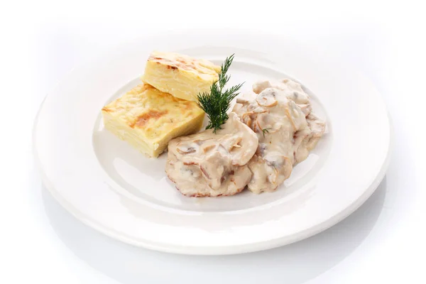 Delicious lunch. Casserole with mushroom sauce on white — Stock Photo, Image