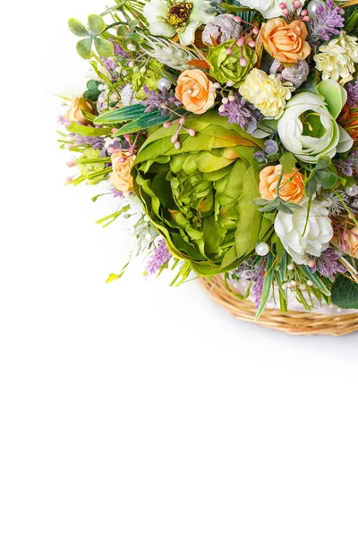 Basket with flowers to celebrate Easter on a white background — Stock Photo, Image