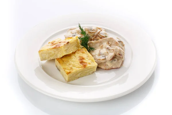 Delicious lunch. Casserole with mushroom sauce on white — Stock Photo, Image