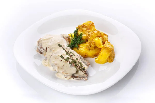 Delicious lunch. Potatoes in French mustard with meat in mushroom sauce — Stock Photo, Image