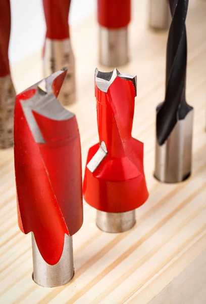 Various shapes drill bits for wood on wooden stand. close-up — Stock Photo, Image