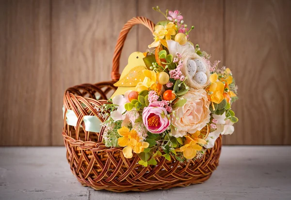 Decorative basket decorated with flowers — Stock Photo, Image