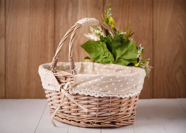 Basket on a wooden background — Stock Photo, Image