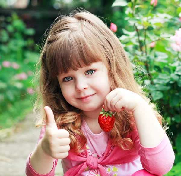 Little girl with strawberry, say OK — Stock Photo, Image