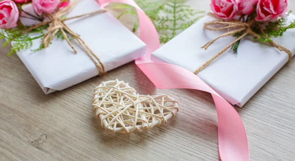 Composition with gift boxes and wooden heart — Stock Photo, Image