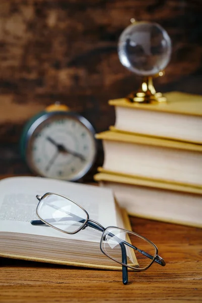 Education concept - books on the desk in the auditorium — Stock Photo, Image