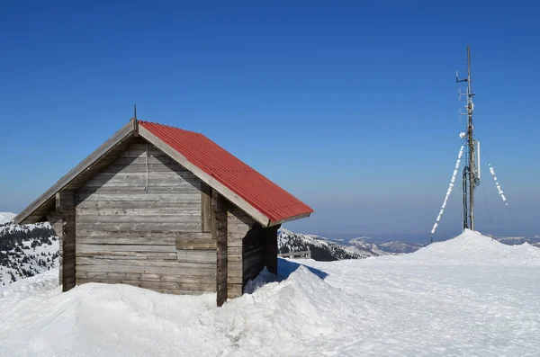 Sheller and antenna in melting snow — Stock Photo, Image