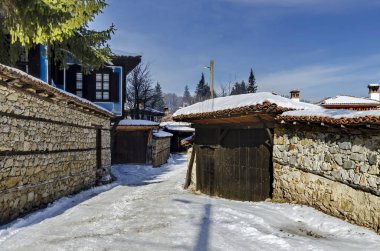 Antique cobblestone street with beauty ancient houses, town Koprivshtitsa clipart