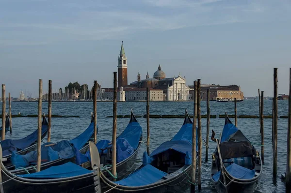 Gondolas moored by Saint Mark square and San Giorgio Maggiore Island with Basilica Santa Maria della Salute in the background, Venezia, Venice — Stock Photo, Image
