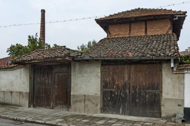 Panagyurishte, Bulgaria - September 07, 2011: View of a residential neighborhood of old houses with interestingly architecture in Panagyurishte town, Bulgaria, Europe. Visit in place. 