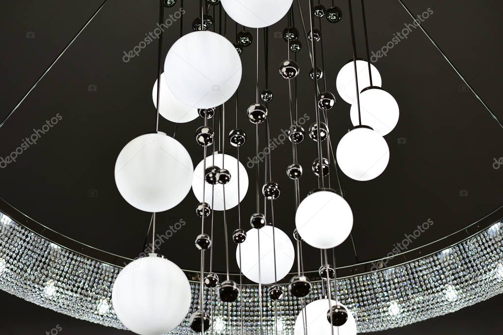 Large chandelier with round shades and metal balls