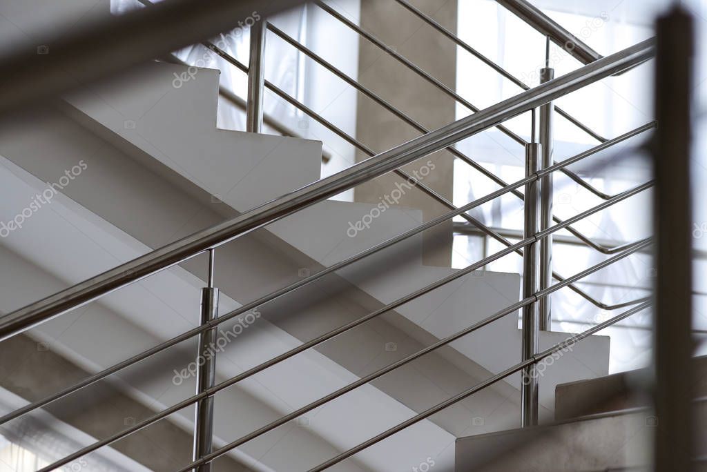 Staircase in a building with metal railing