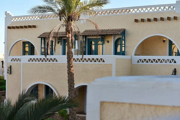 Large African villa with palm trees in the courtyard — Stok fotoğraf