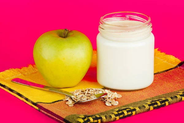 Jar with yogurt isolated on pink background. — Stock Photo, Image