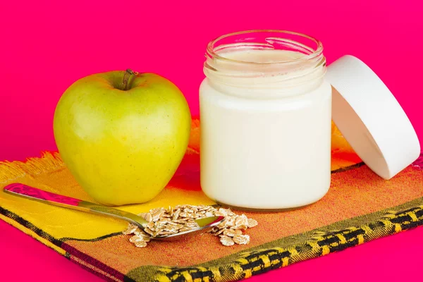 Jar with yogurt isolated on pink background. — Stock Photo, Image