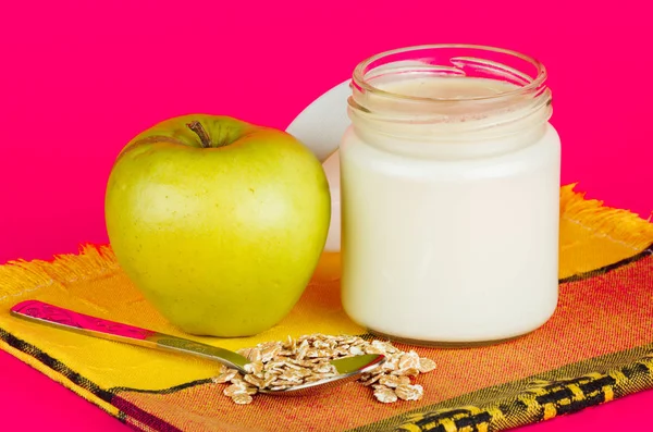 Jar with yogurt isolated on pink background. — Stock Photo, Image