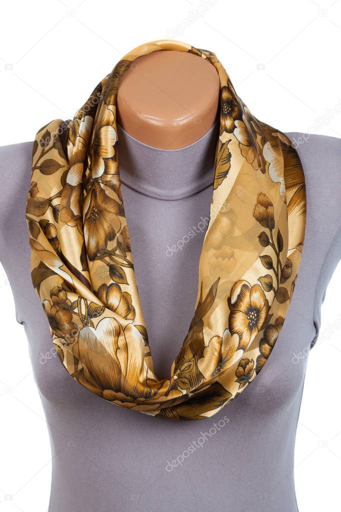 Beige scarf on mannequin isolated on white background.