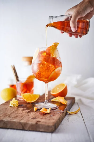 Alcoholic cocktail with orange peel and ice — Stock Photo, Image