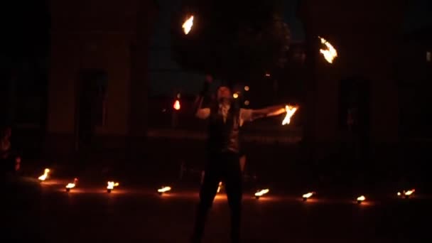 Minsk, Belarus - August 8, 2019: Male professional performing fire show. The view becoming blurred — Stock Video