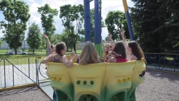 Mogilev, Belarus - 25 August 2019: Teenagers enjoying rotating pendulum attraction in entertainment park. Close bottom view — ストック動画