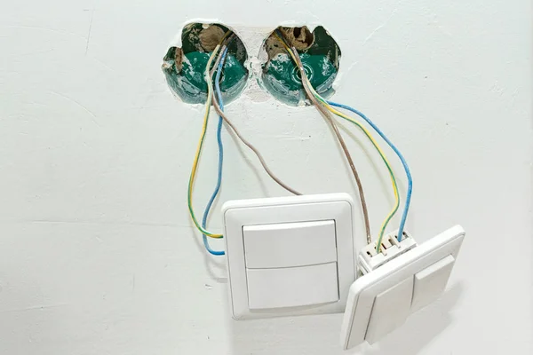 The switch hangs on the wires
