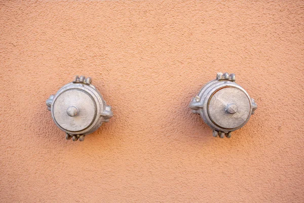 Steel fire hydrant in the concrete wall — Stock Photo, Image