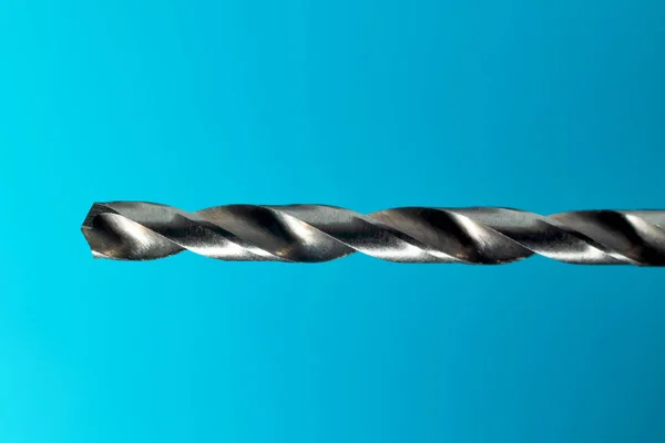 Drill Bit Close Up On Blue Background — Stock Photo, Image