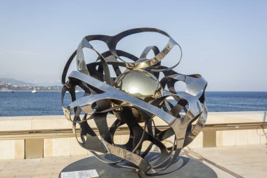Modern art sculpture on the harbour wall, Port Hercule, Monaco.