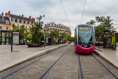 Pink Tram on railway in city at Dijon, France