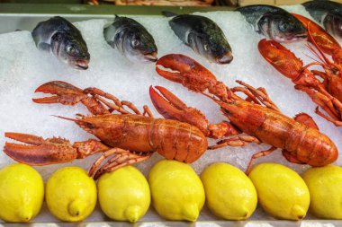 A lot of crawfish in a market place
