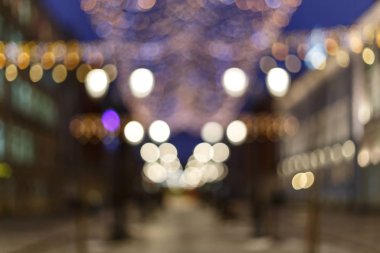 Şehir gece ışığının parlak renk tarzındaki bulanık bokeh arkaplanı.