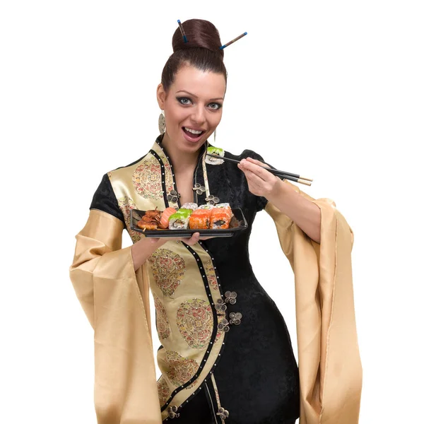 Mulher em vestido tradicional com comida oriental — Fotografia de Stock