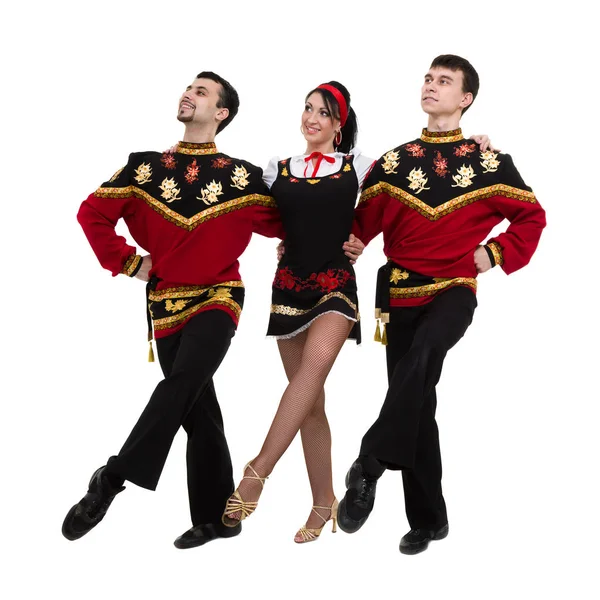 Two men and one woman wearing a folk russian costume posing — Stock Photo, Image