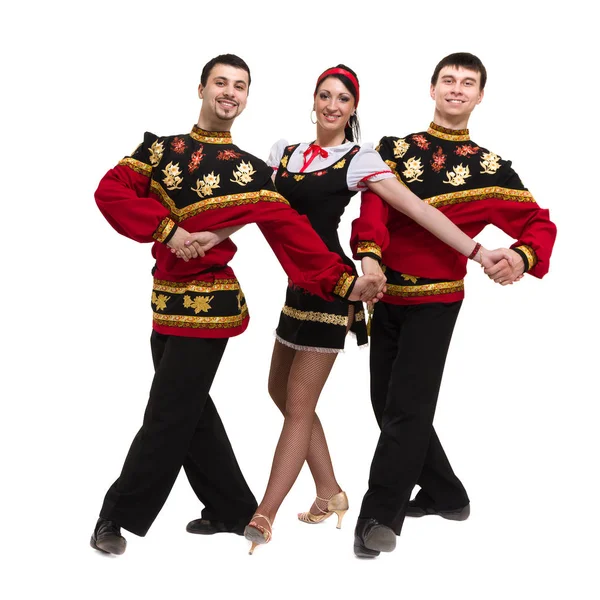 two men and one woman wearing a folk russian costume posing