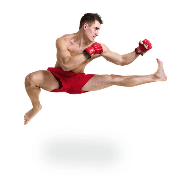 Full length portrait of young male boxer showing some movements against isolated white background — Stock Photo, Image