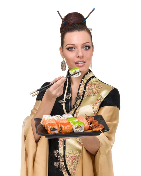 Mulher em vestido tradicional com comida oriental — Fotografia de Stock