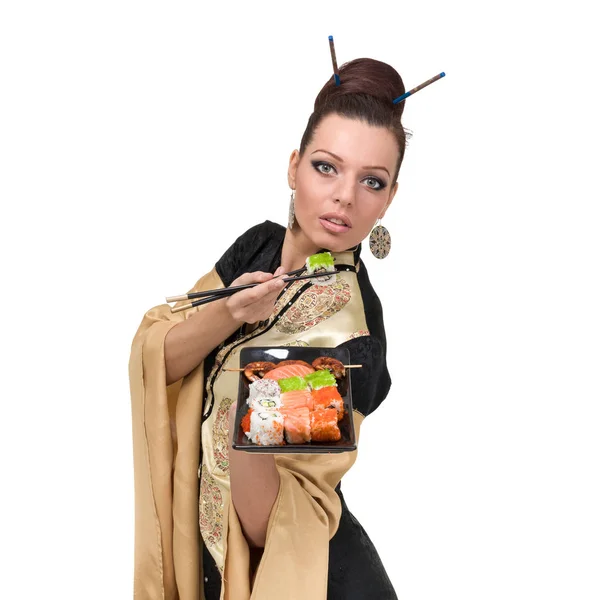 Mujer en vestido tradicional con comida oriental —  Fotos de Stock