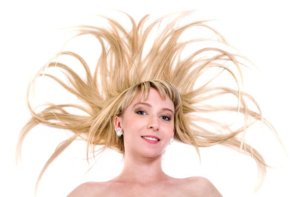 Happy young woman with flying hair on white — Stock Photo, Image
