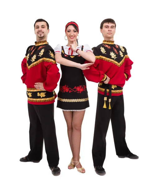 Two men and one woman wearing a folk russian costume posing — Stock Photo, Image