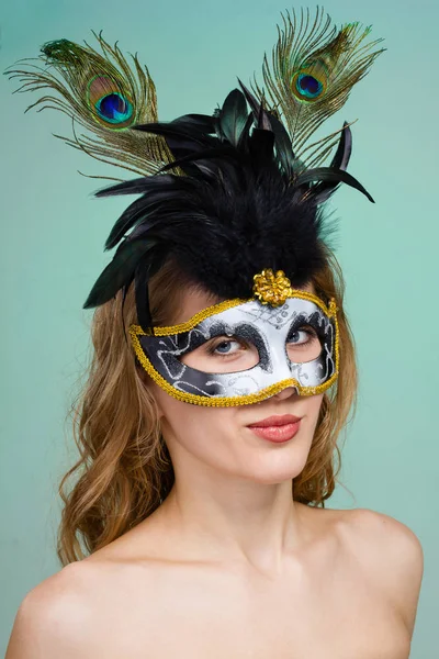 Carnival dancer woman wearing a mask posing on green — Stock Photo, Image