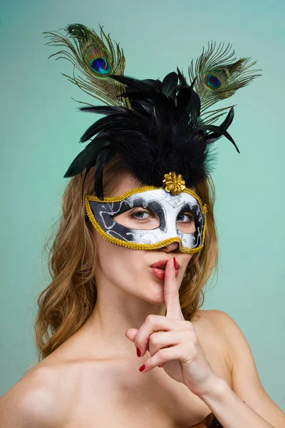 Carnival dancer woman wearing a mask posing on green — Stock Photo, Image