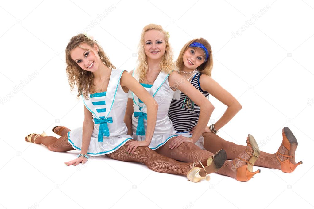 Dance team in sailor uniform posing against isolated white background
