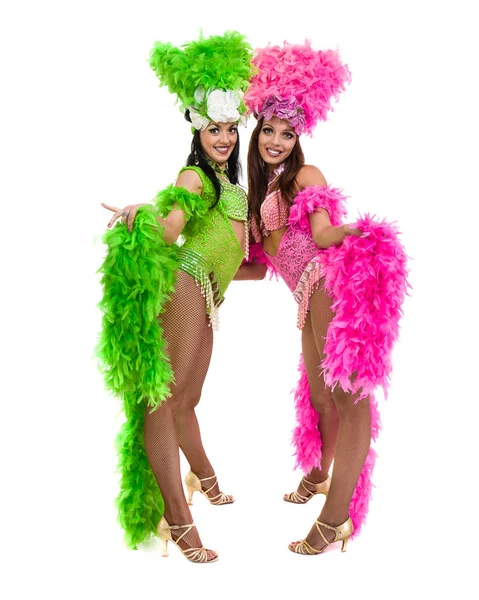 Two carnival dancer women dancing against isolated white background — Stock Photo, Image