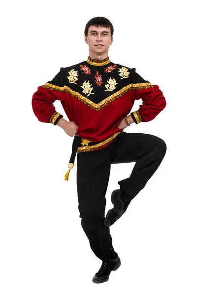 Ung man klädd i en folklig ryska kostym poserar — Stockfoto